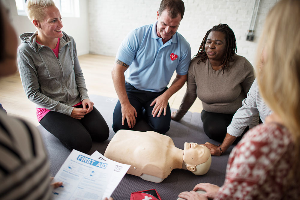 Adults learning CPR