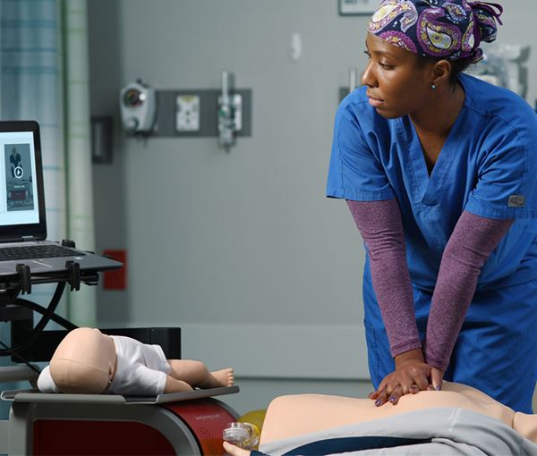 RQI landing nurse practicing on RQI mobile Simulation Station