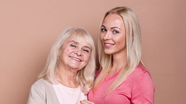 Two women smiling for camera