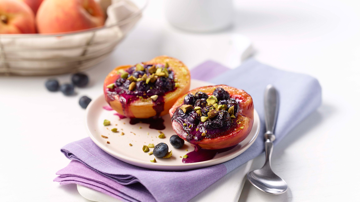 Broiled Glazed Peaches Stuffed with Blueberry Compote and Cream Cheese
