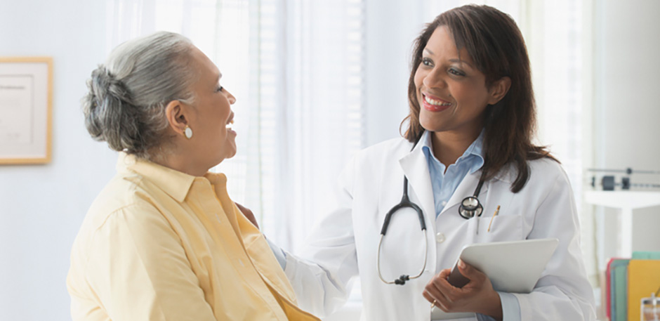 female patient speaking with female doctor
