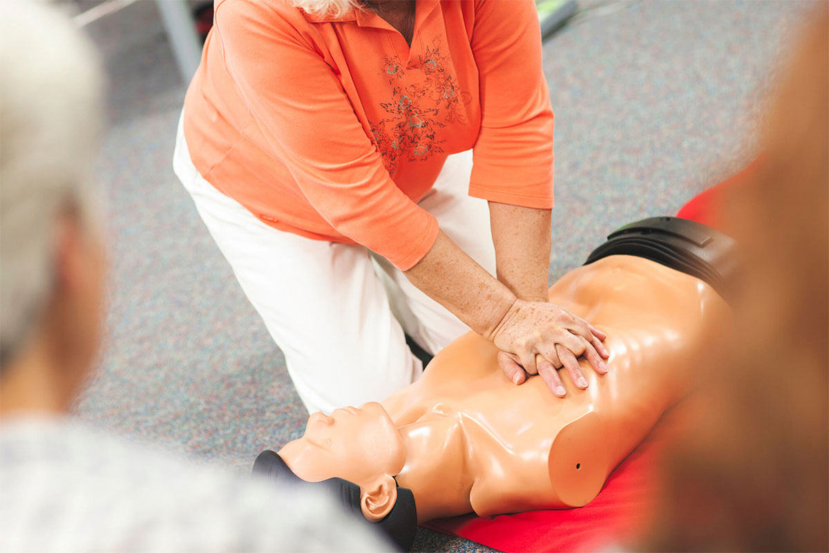 Practicing CPR on a manikin