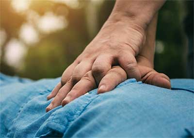 hands performing hands only cpr