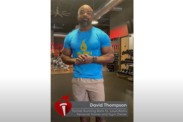 video screenshot of former NFL player, David Thompson, standing in a gym