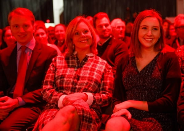 Jacob, Lisa and Lauren watching John deliver his presidential address. (Photo by American Heart Association)