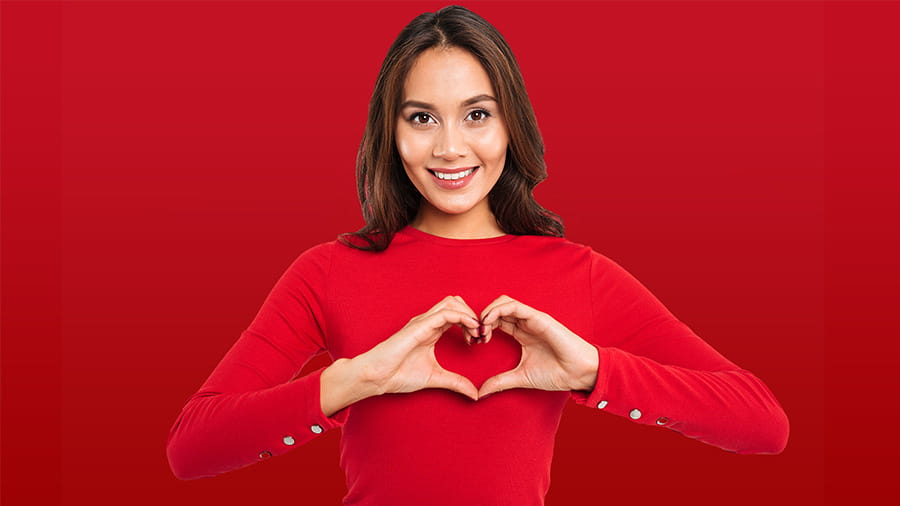 Woman with heart hands