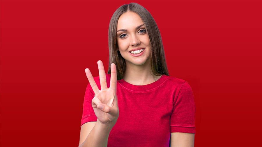 Women with three fingers held up