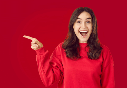 Woman pointing with red background