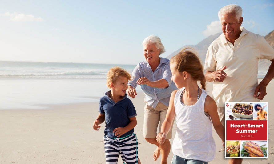 multigenerational family runs on beach on summer day