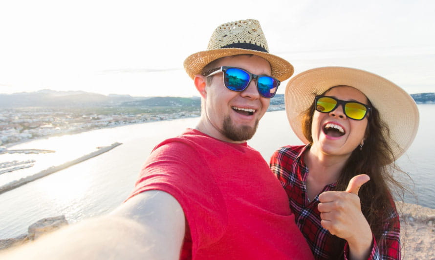 hipster male and female couple at the beach