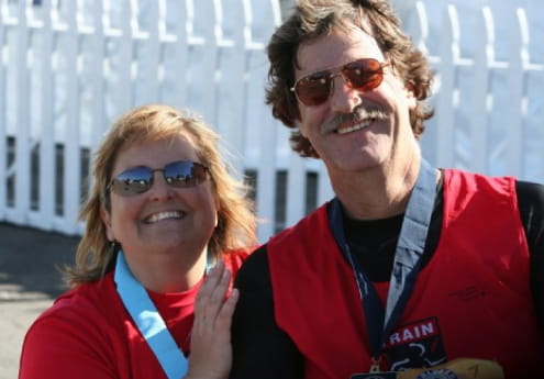 Louise Brandy and her husband, Mycle, pictured at the finish line for one of Mycle's walks to raise awareness about Stroke