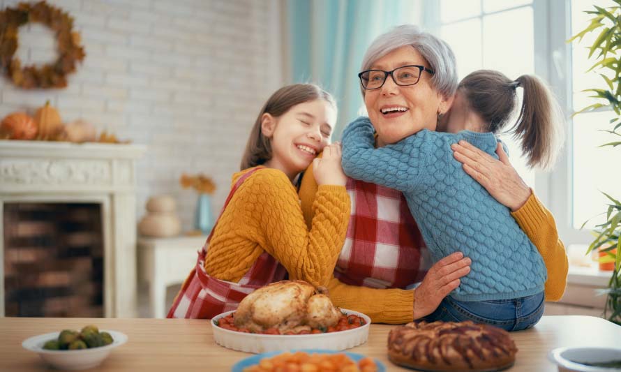 grandma hugging granddaughters