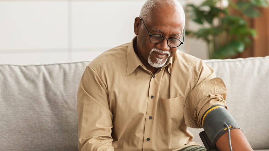 senior man monitors his blood pressure at home senior man monitors his blood pressure at home