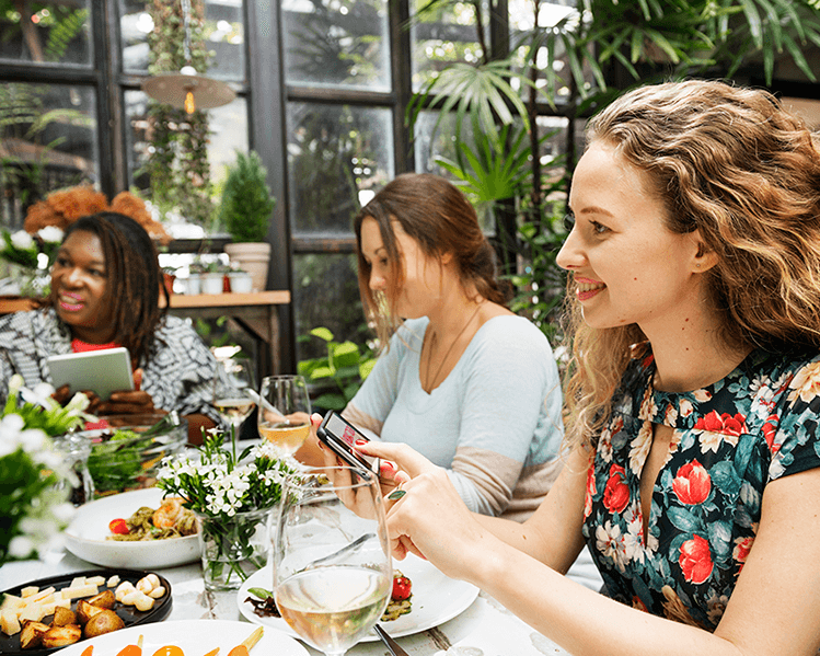 diverse group of women eating together