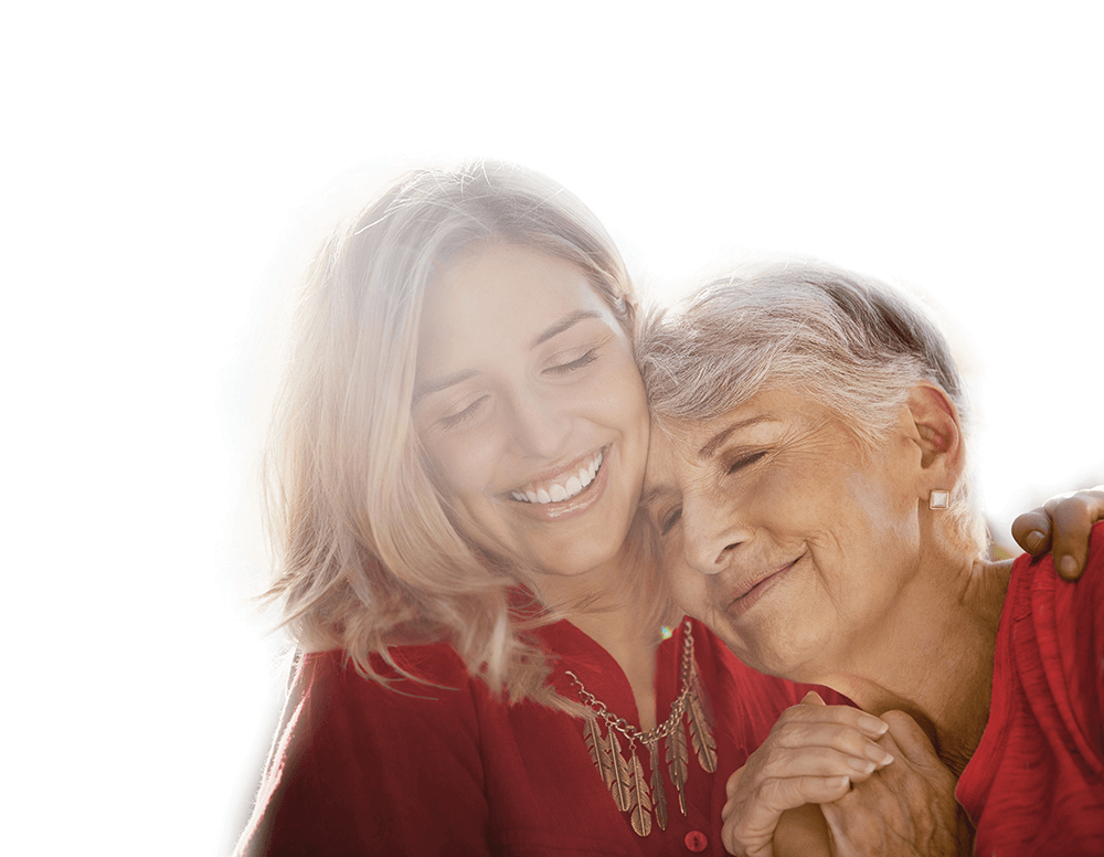 woman and her elderly mother hugging and smiling
