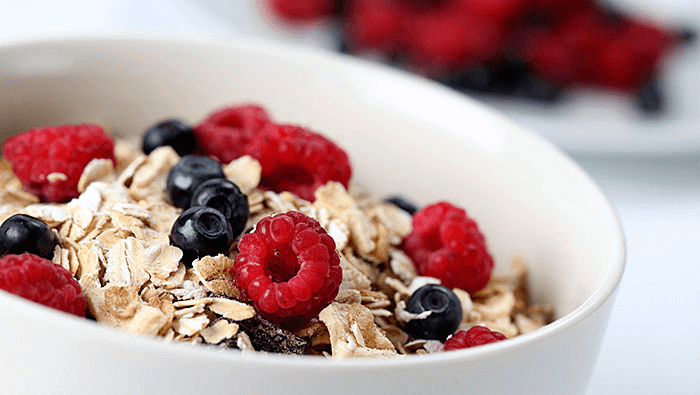 bowl of oatmeal with blueberries and raspberries