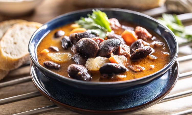 bean soup in a blue bowl