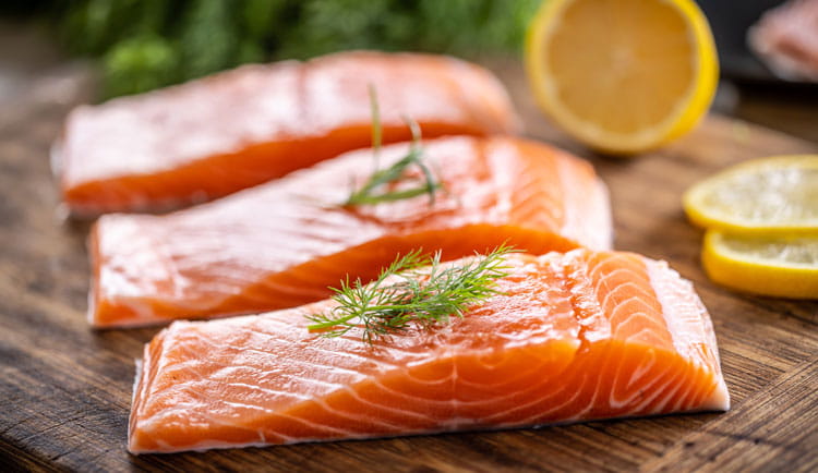 Salmon fish on a cutting board.