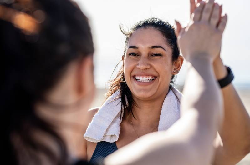 Women giving a high five after a workout