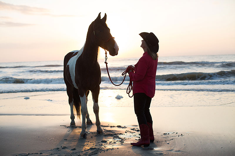 Debby and her horse at sunset - beach ride