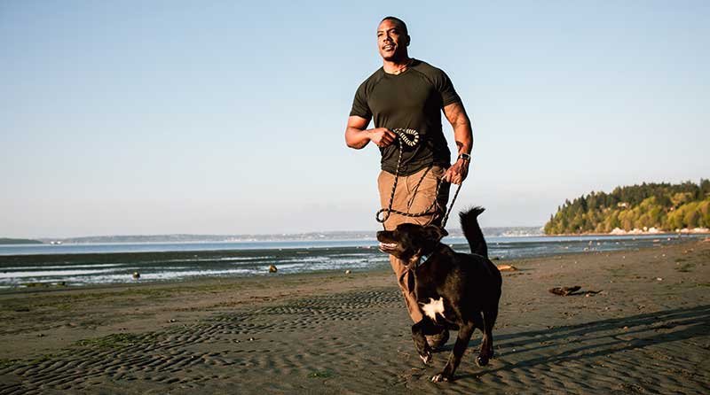 https://www.heart.org/-/media/Healthy-Living-Images/Healthy-Lifestyle/Pets/man_running_dog_beach.jpg