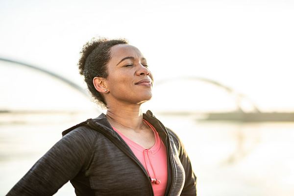 woman listens with eyes closed