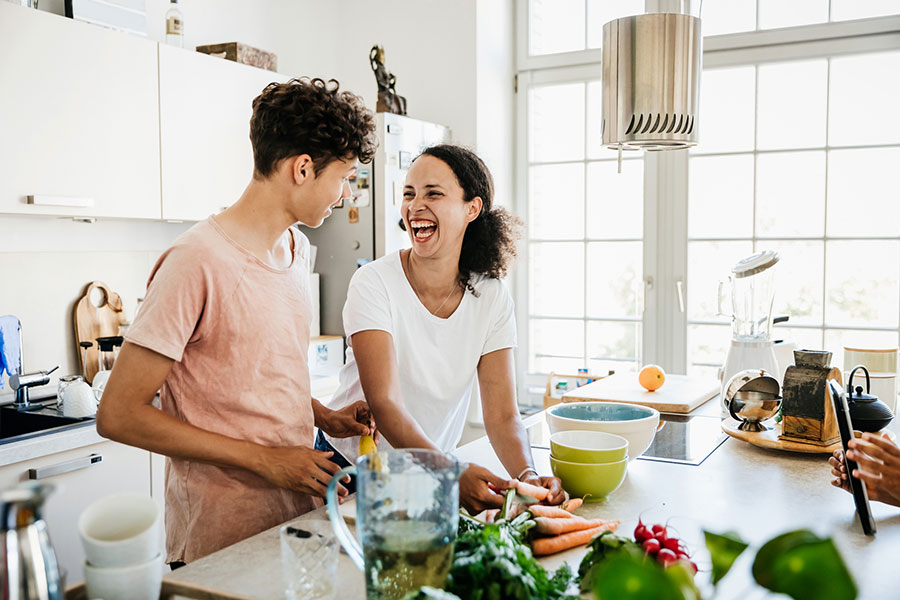 Mom and son cooking in kitchen