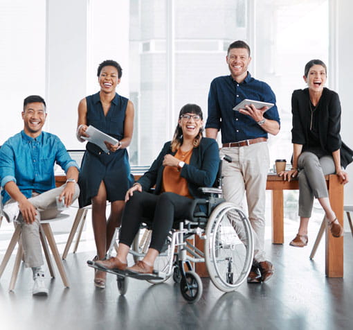 group of smiling business people working together in an office