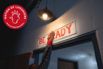 hand slapping sign that reads be ready