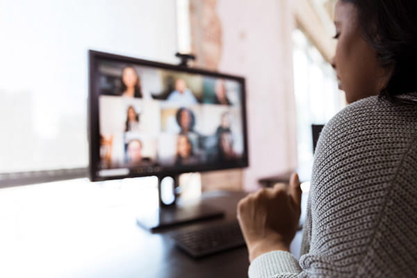 A woman is on a video conference from an office