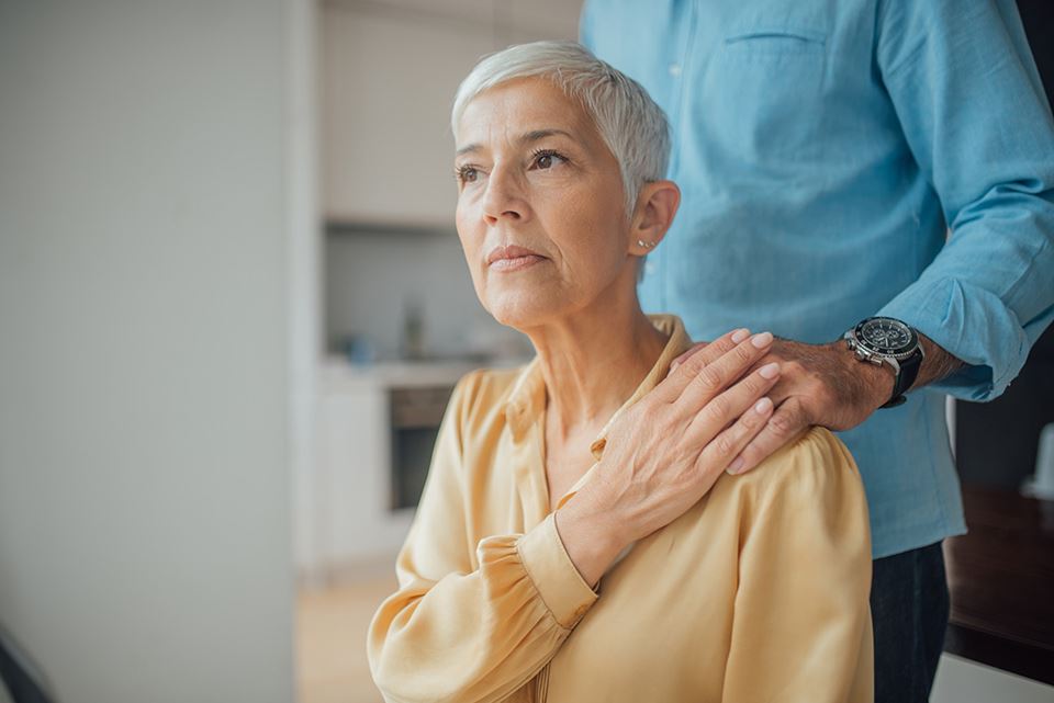 Woman being comforted by a friend