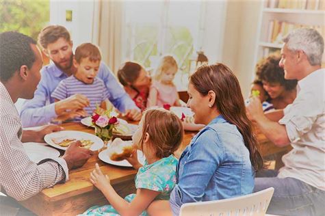 family eating meal at table