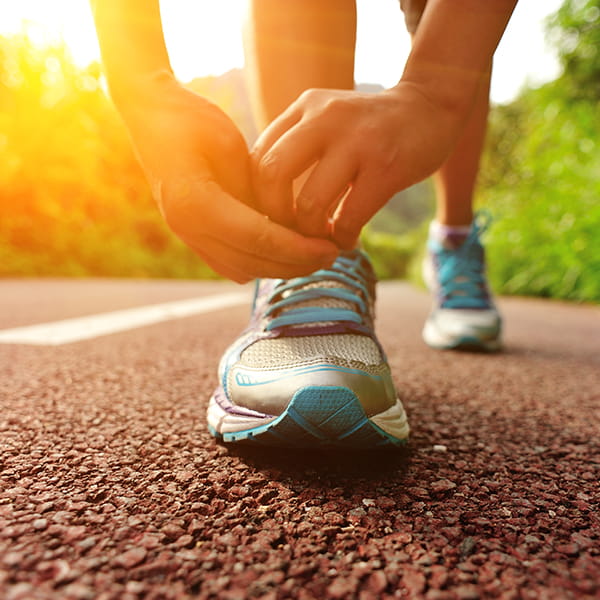 Tying laces on a running shoe
