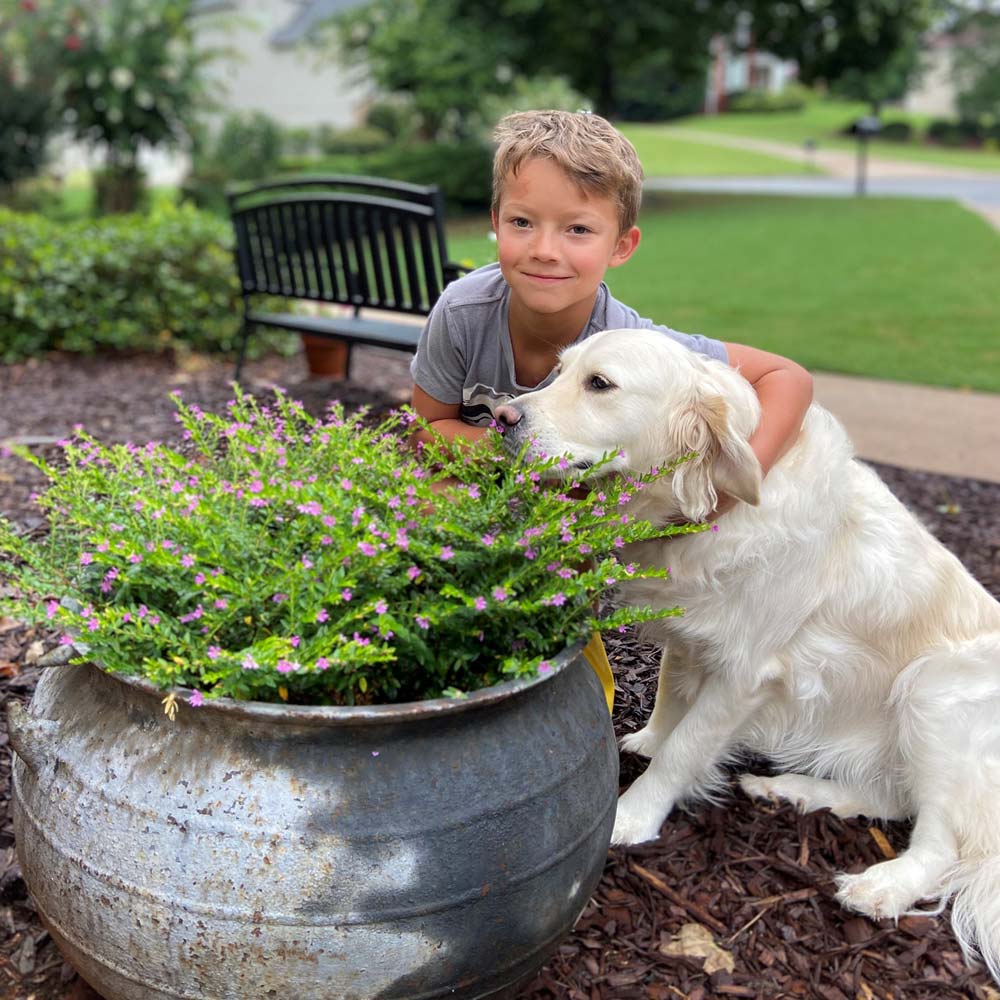Reagan Wyatt hugging his dog