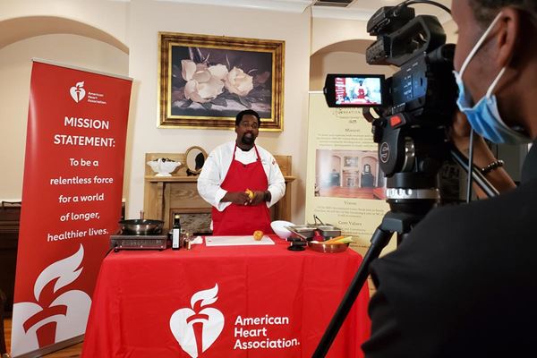 Chef N'gai being filmed for cooking show