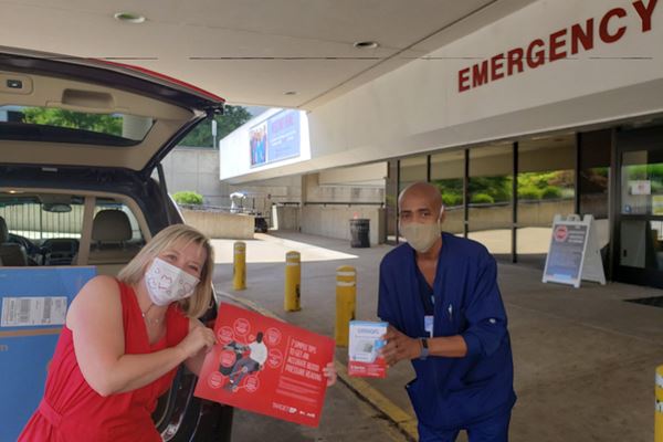 masked people outside ER entrance