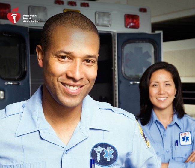 two EMTs smiling