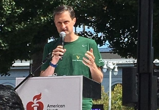 Mike Roffler giving a speech at a podium during an American Heart Association event