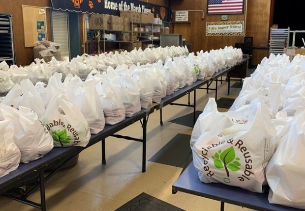 image of bags of food lined up in a high school gym