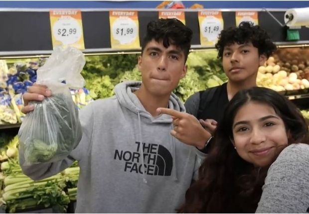 three young students in the grocery store