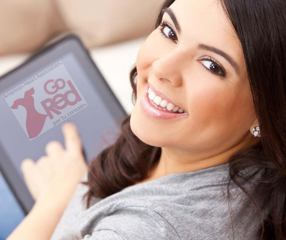Latina smiling on computer