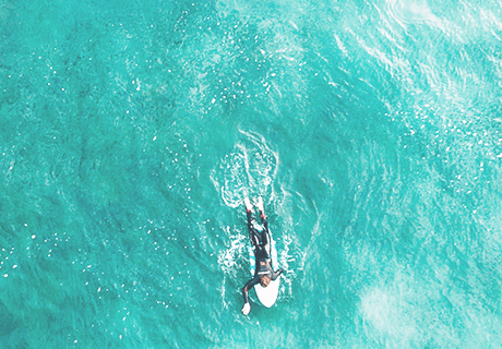 man surfing in blue ocean