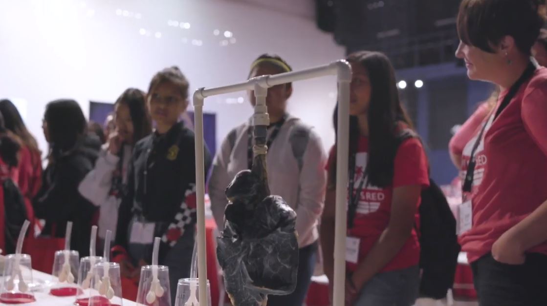teenage girls participate in a STEM event in Orange County, they are looking at organs in this image