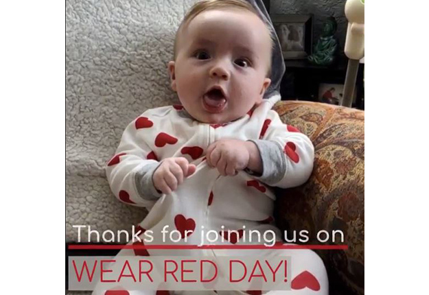 Baby in a white onesie with read hearts. Text that reads Thanks for joining us on Wear Red Day!