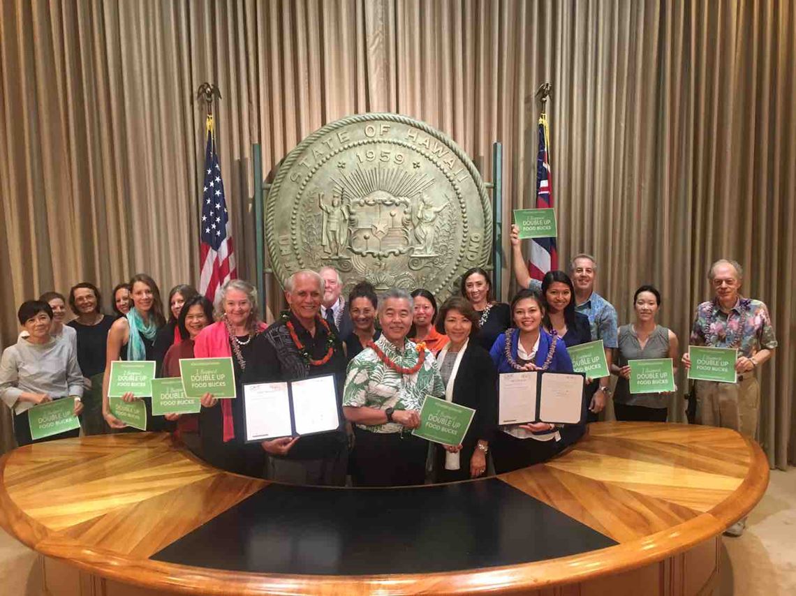 Hawaii Advocacy SNAP 2019 group stands with Governor Ige after he signed into law act 153