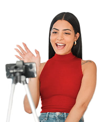 woman in red shirt filming herself on phone