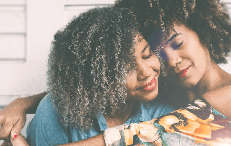 Two women hugging