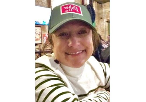 Nan Murphy in hat smiling