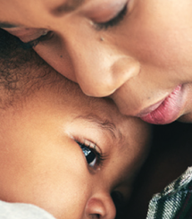 mom cuddling child