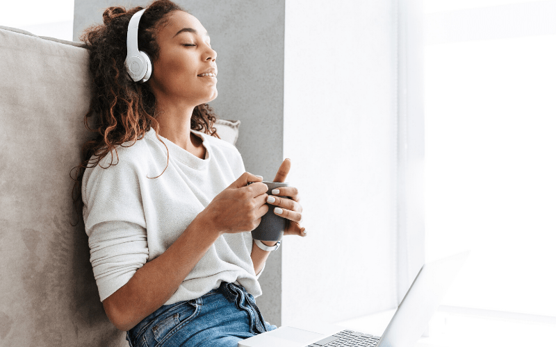 woman relaxing with coffee and music